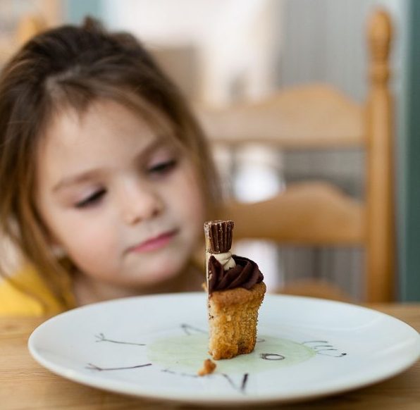 parent communication skills kid admiring cupcake.