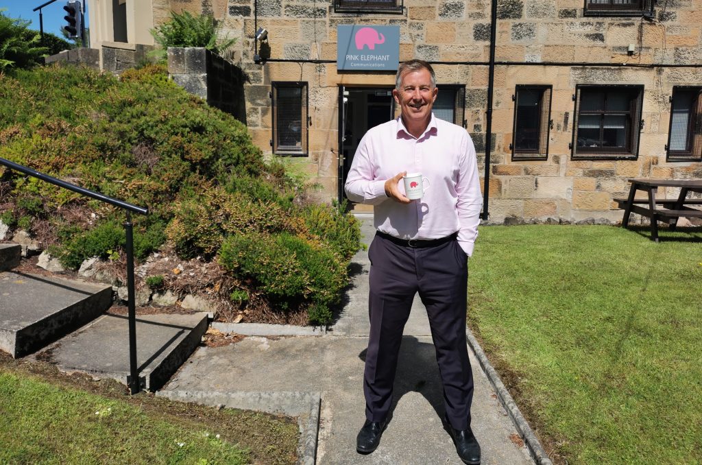how to ad lib a speech, bill mcfarlan stands outside pink elephant communications