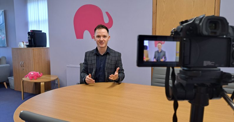 Voice coaching Glasgow, Colin stone on camera in the pink elephant studio