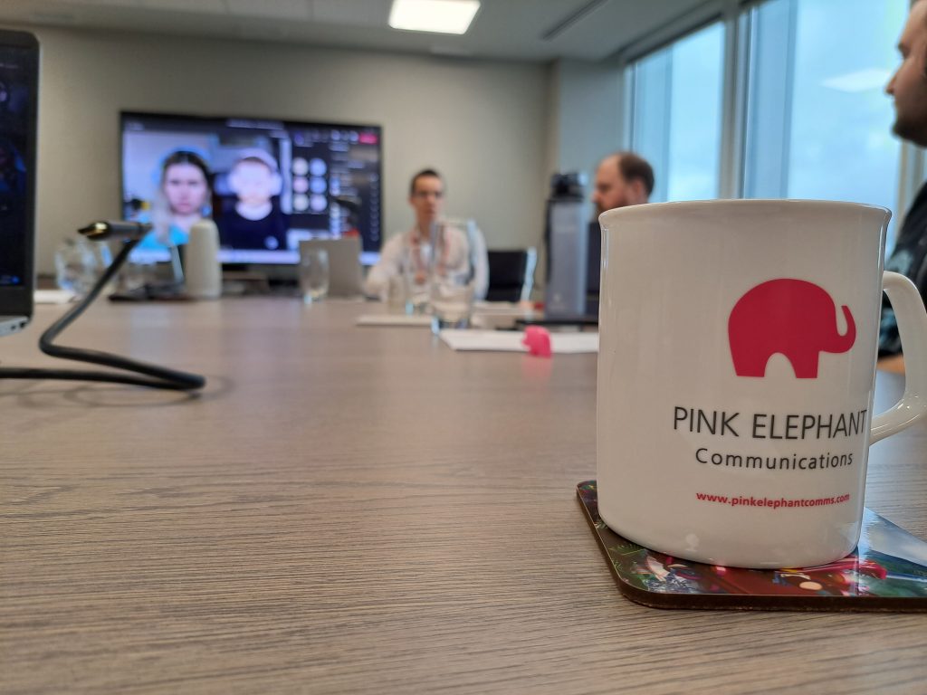 communication skills training, pink elephant mug on table
