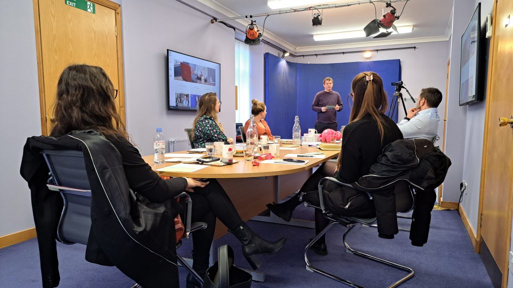 london presentation skills, andrew mcfarlan sits around the table