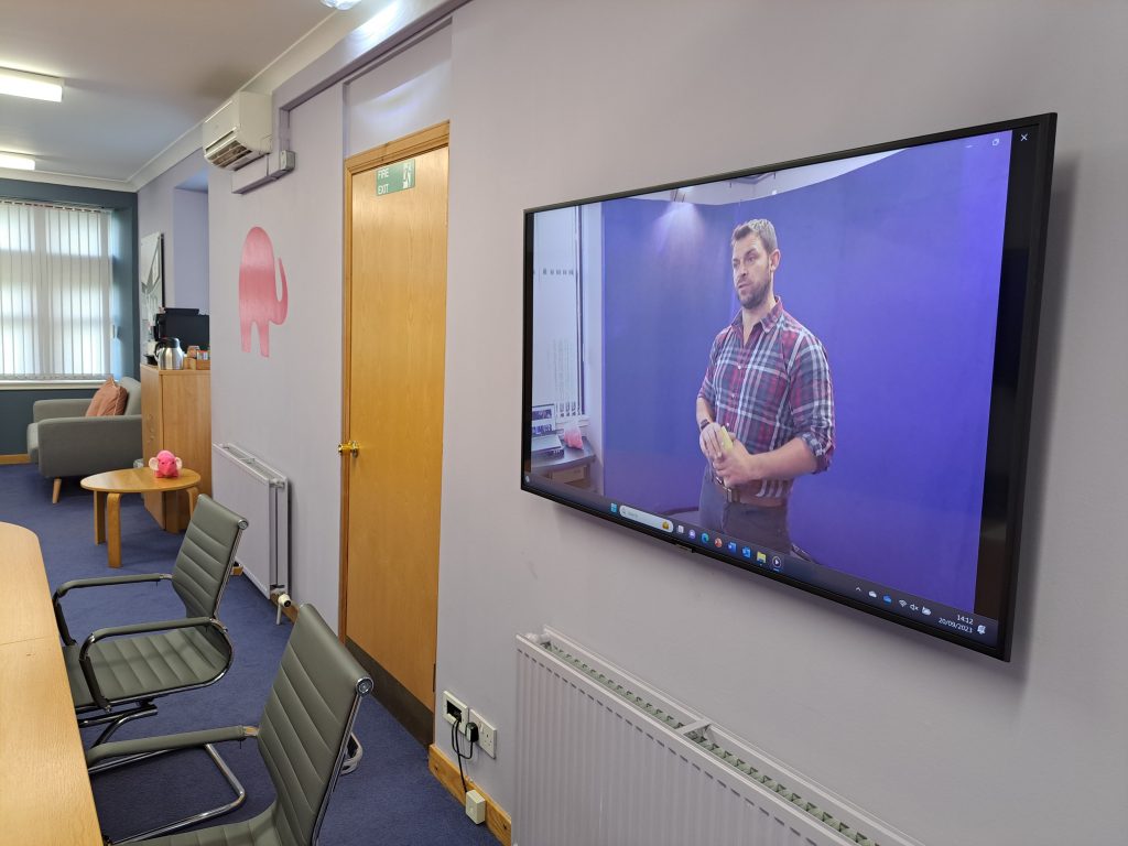 storytelling training uk, a course participant on the TV screen