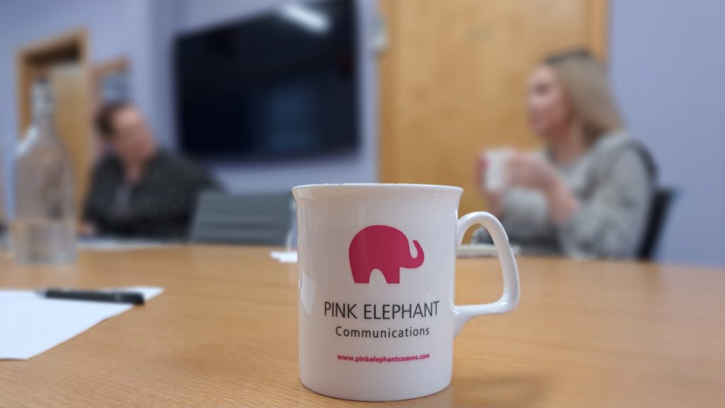 media training manchester, cup on table, Pink Elephant Communications